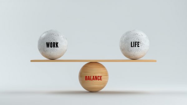 spheres forming scale with the words WORK, LIFE and BALANCE on white background - 3d rendered illustration